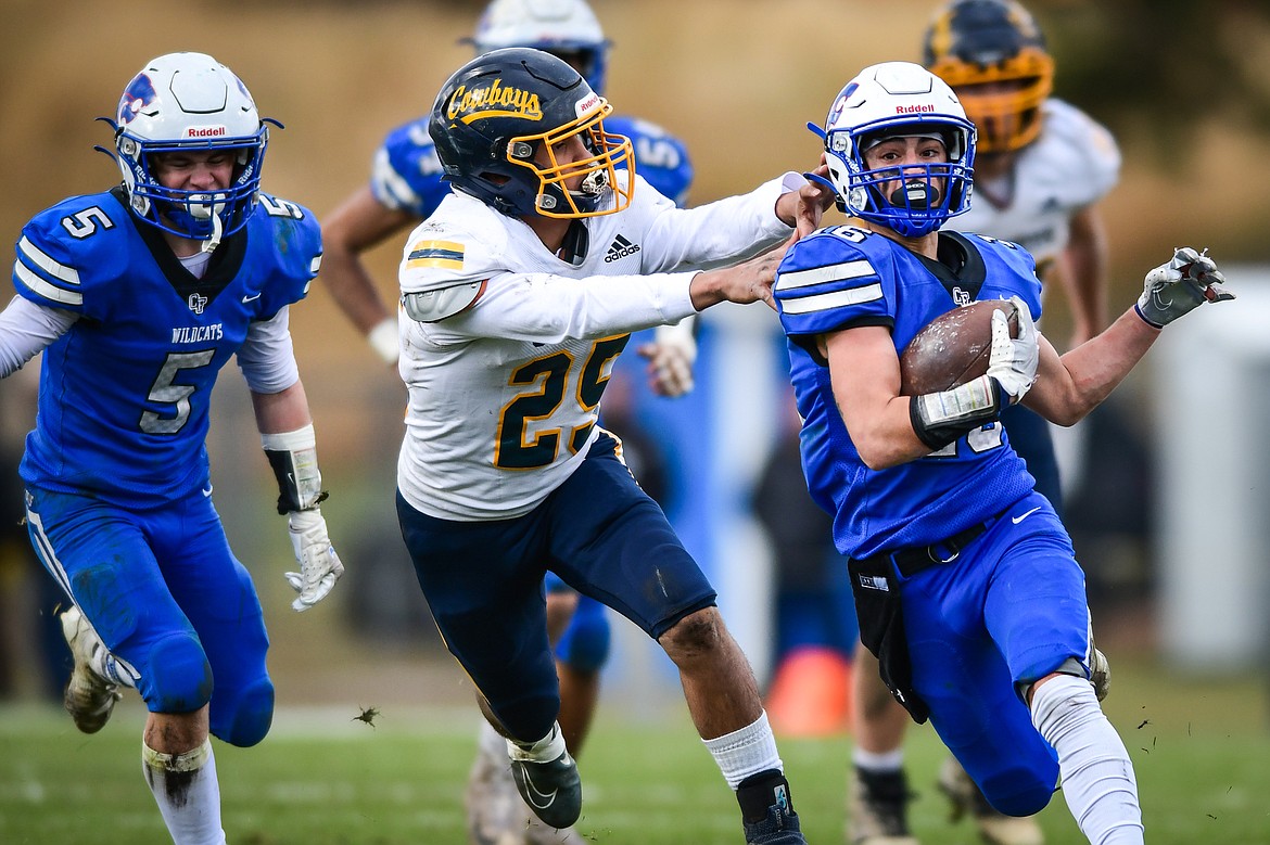 Columbia Falls running back Tyler Gilfry (16) picks up yardage on a run in the second quarter against Miles City at Satterthwaite Field on Saturday, Oct. 29. (Casey Kreider/Daily Inter Lake)