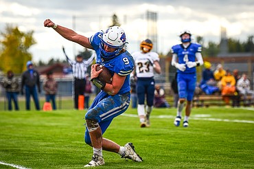 Columbia Falls quarterback Cody Schweikert (9) celebrates in the end zone after a run for a touchdown in the second quarter against Miles City at Satterthwaite Field on Saturday, Oct. 29. (Casey Kreider/Daily Inter Lake)