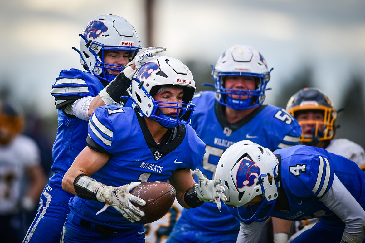 Columbia Falls celebrates with wide receiver Justin Windauer (1) after Windauer caught a 25-yard touchdown reception in the second quarter against Miles City at Satterthwaite Field on Saturday, Oct. 29. (Casey Kreider/Daily Inter Lake)