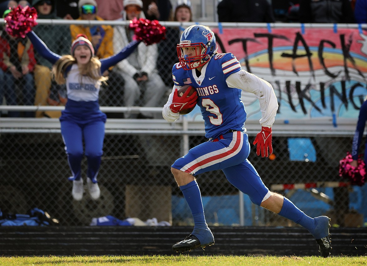 Bigfork's Isak Epperly breaks free down the sideline for the game-winning touchdown in the fourth quarter of Bigfork's 21-16 win over Manhattan in the State B playoffs in Bigfork on Saturday, Oct. 29. (Jeremy Weber/Daily Inter Lake)