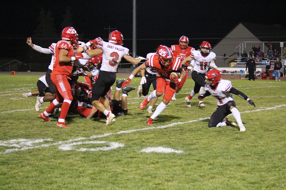 Sunny Asu (4), Othello, makes his way downfield against the East Valley (Yakima) defense.