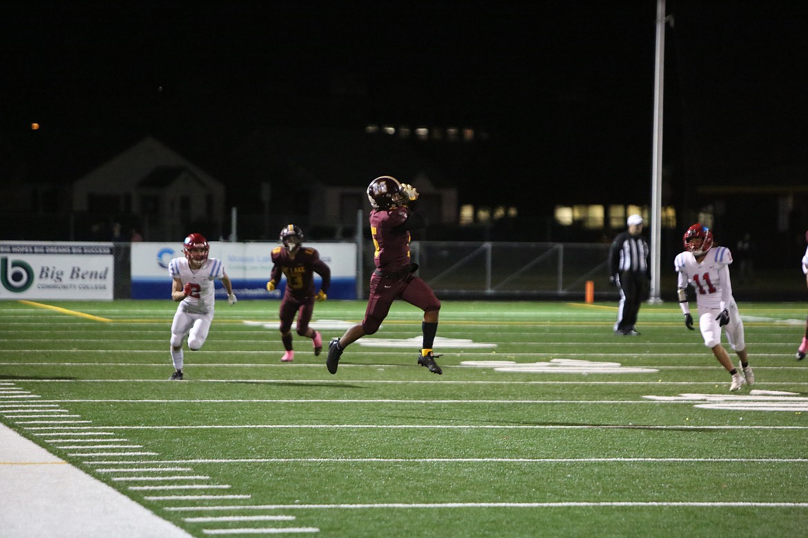 Moses Lake receiver Kyson Thomas gets vertical to haul in a 26-yard catch-and-run in the fourth quarter.