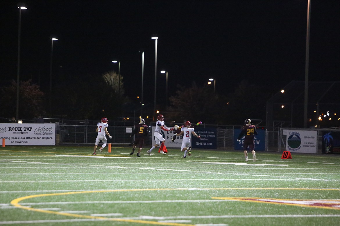 Eastmont receiver Adrian Ruffins (4) hauls in a deflected pass for a 57-yard walk-off touchdown.