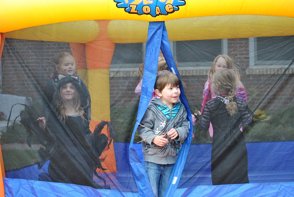 Young festival attendants bounced off the sugar in the blow up bounce house and big inflatable slide. (Amy Quinlivan/Mineral Independent)