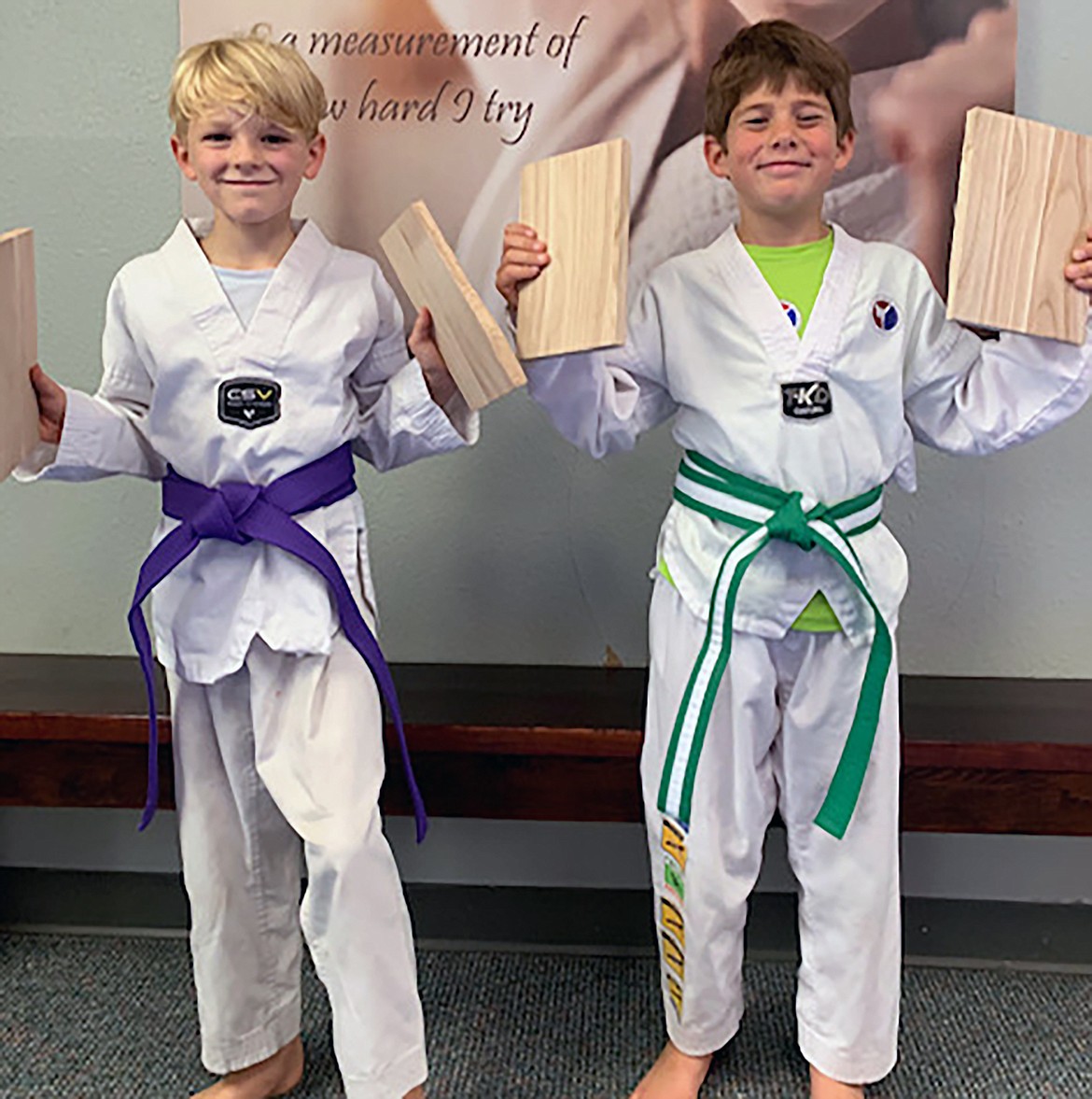 Gavin Schuck, left, recently earned a purple belt, while Dom Cipriano, right, recently earned a green stripe belt in recent belt testing at Sandpoint Martial Arts.