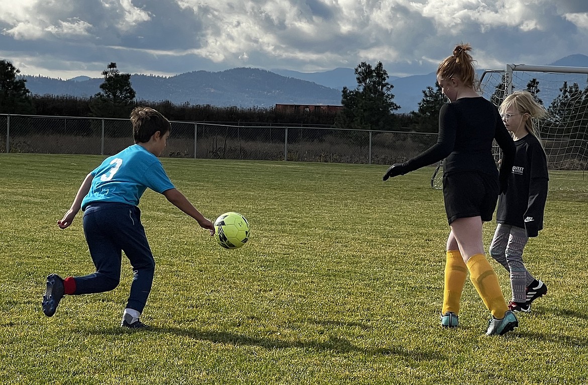 Courtesy photo
Abel Hall, left, of Ziply Fiber Blue heads downfield to score one of his three goals in a Hayden Recreation and Community Services 8U league soccer game on Oct. 29.