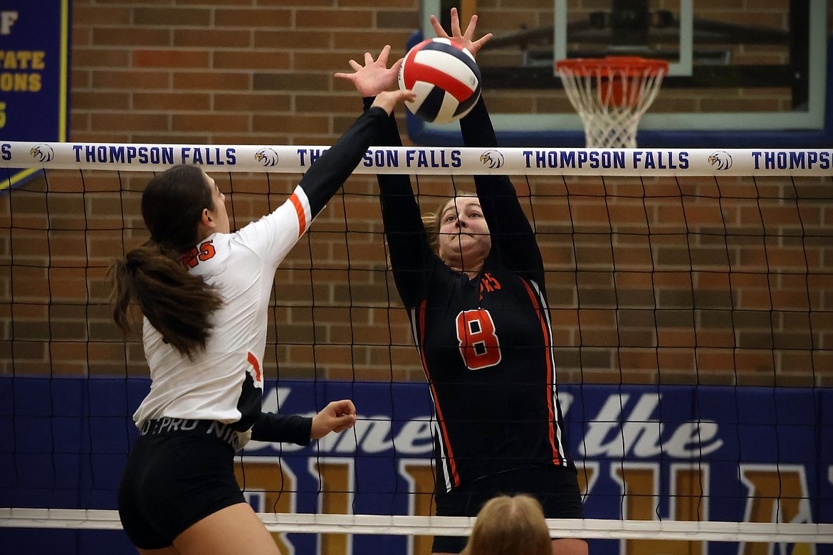 Lexie Demming records a block for Plains in the opening round of the 7B District Volleyball Tournament in Thompson Falls Friday. (Jeremy Weber/Daily Inter Lake)