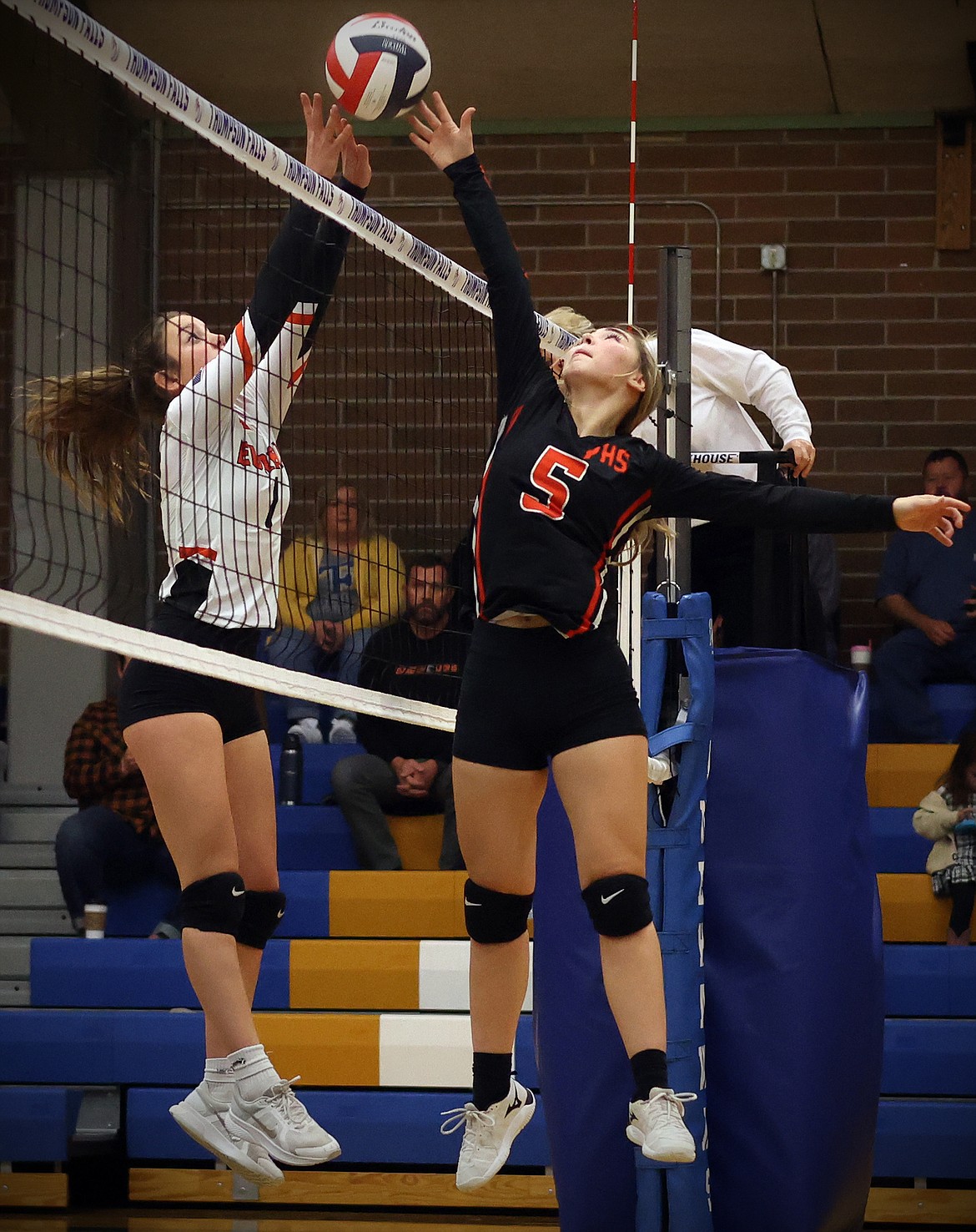Plains player Marissa Young battles with Eureka's Aubrey Cazazza in a play at the net in the opening round of the 7B District Volleyball Tournament in Thompson Falls Friday. (Jeremy Weber/Daily Inter Lake)