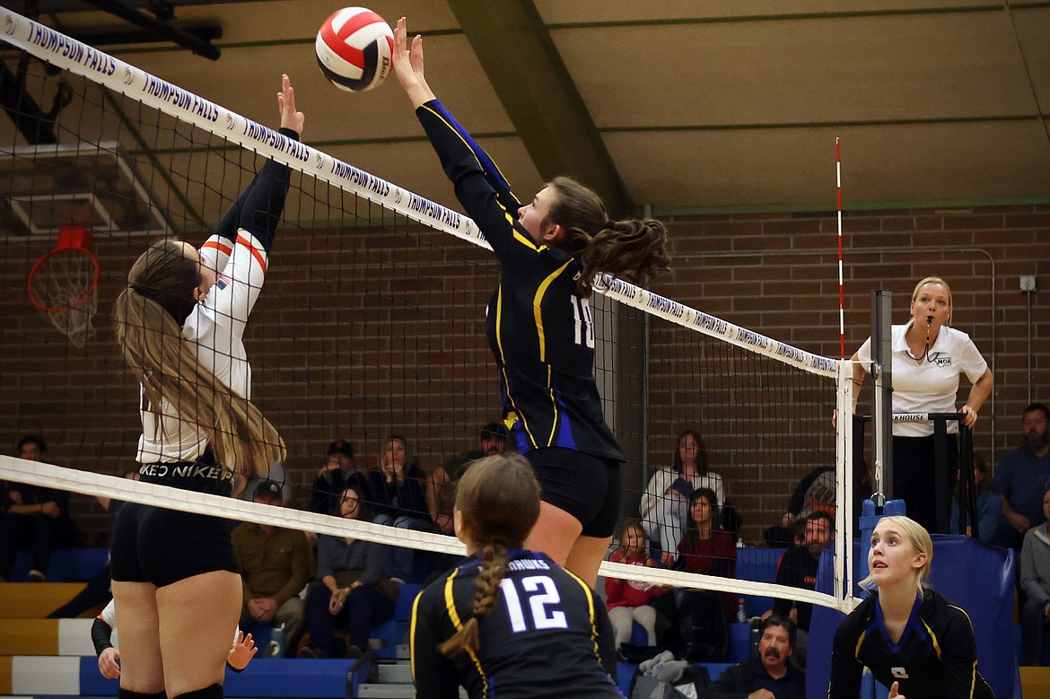 The Blue Hawks' Ellie Baxter sends back a Eureka push at the net during action in the second round of the 7B District Volleyball Tournament in Thompson Falls Friday. (Jeremy Weber/Daily Inter Lake)