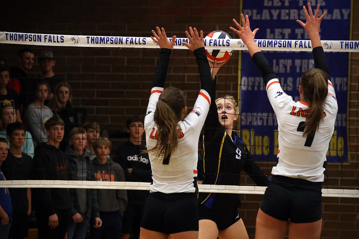 The Blue Hawks' Gabrielle Hannum makes a play at the net in the second round of the 7B District Volleyball Tournament in Thompson Falls Friday. (Jeremy Weber/Daily Inter Lake)