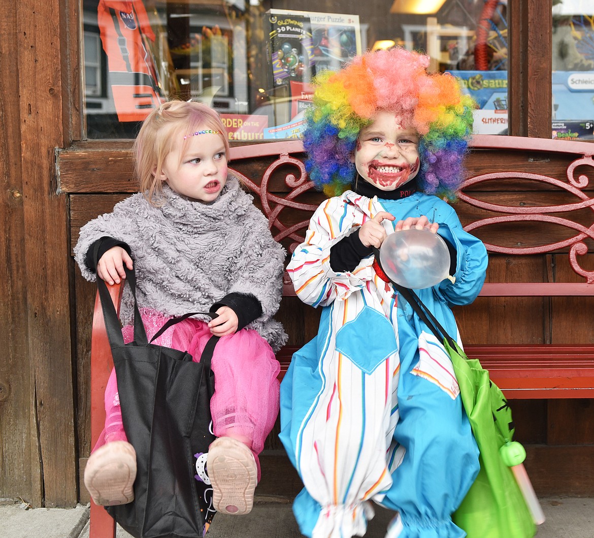 Keeping an eye on the clowns during Treat or Treat Street in downtown Whitefish Monday. (Julie Engler/Whitefish Pilot)