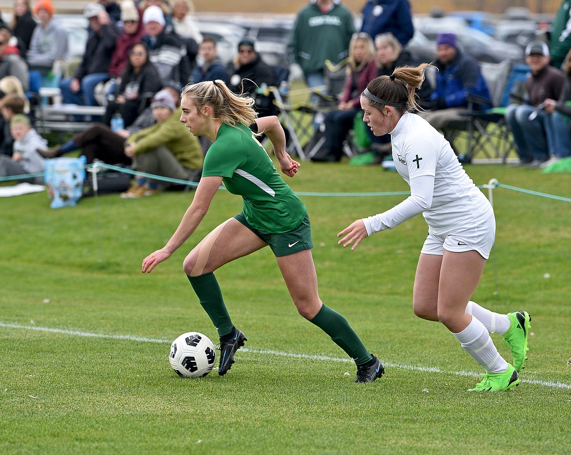 Bulldog Maddie Muhlfeld keeps the ball from a Billings Central player during the State A final on Saturday in Whitefish. (Whitney England/Whitefish Pilot)
