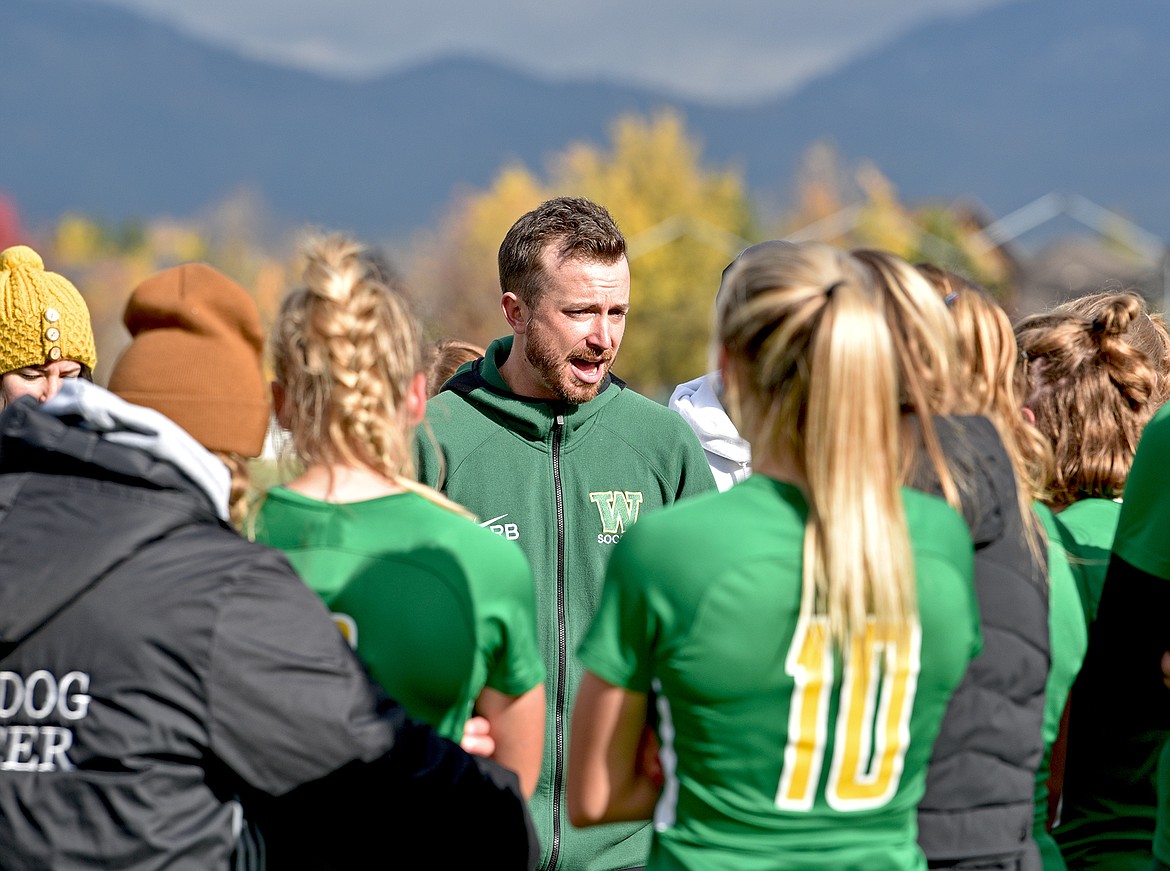 Whitefish girls soccer coach Roland Benedict encourages his players after the Bulldogs lost to Billings Central 2-1 in the State A final on Saturday in Whitefish. (Whitney England/Whitefish Pilot)