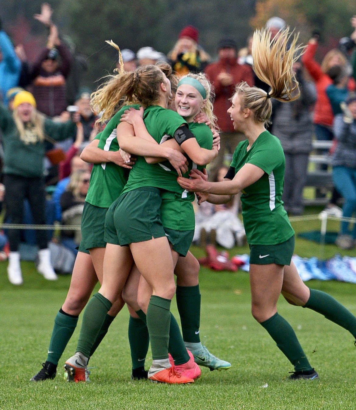 Whitefish players celebrate a second-half goal by Brooke Roberts in the the State A final on Saturday in Whitefish. (Whitney England/Whitefish Pilot)