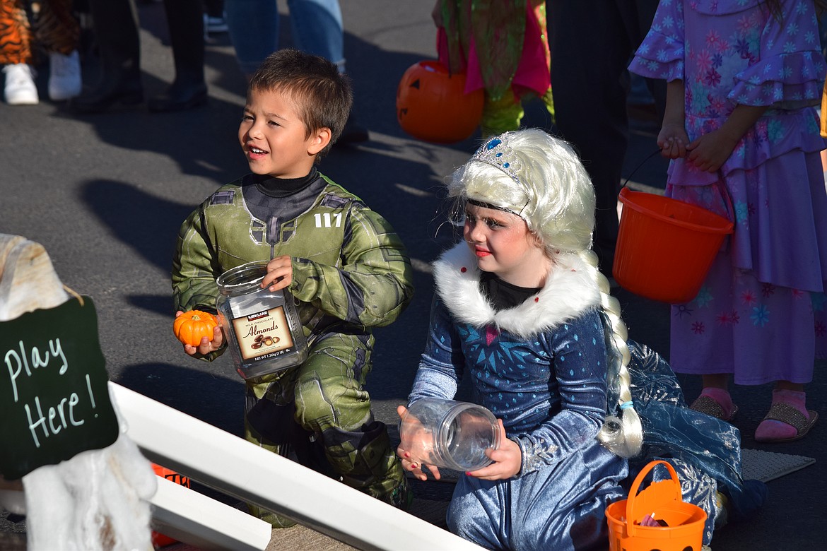 Children play games for candy during the Harvest Festival in Moses Lake on Saturday.