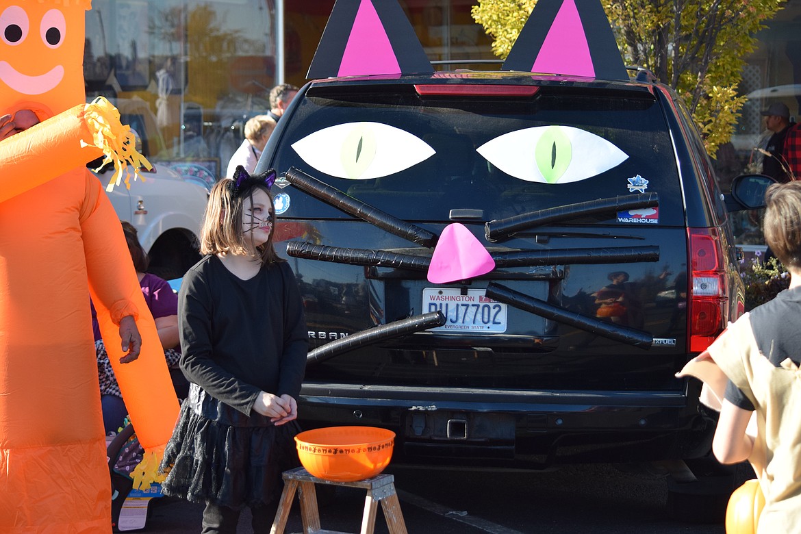 A black SUV “costumed” as a cat for trunk or treat on Third Avenue in downtown Moses Lake during the Harvest Festival on Saturday.