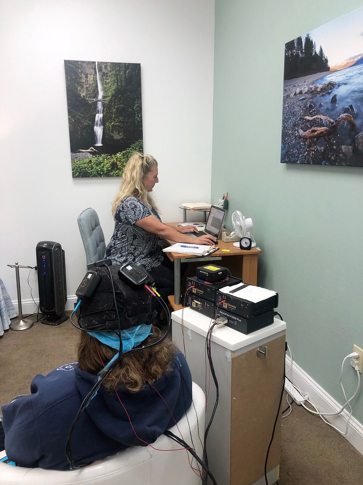 Linda Larson treats a patient during a recent session at the new North Idaho Neurotherapy Clinic.