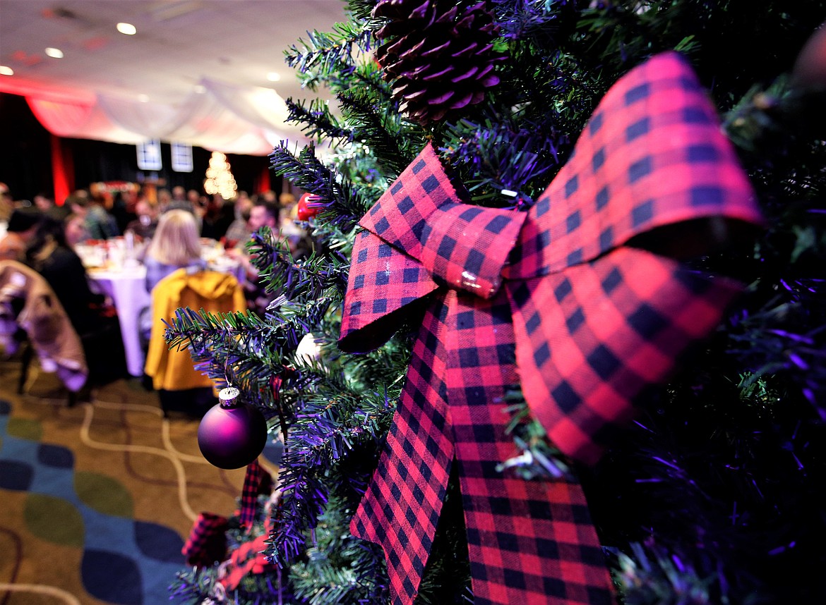 Decorations hang from a Christmas tree at the Flannel Fest Red Kettle Gala on Tuesday.