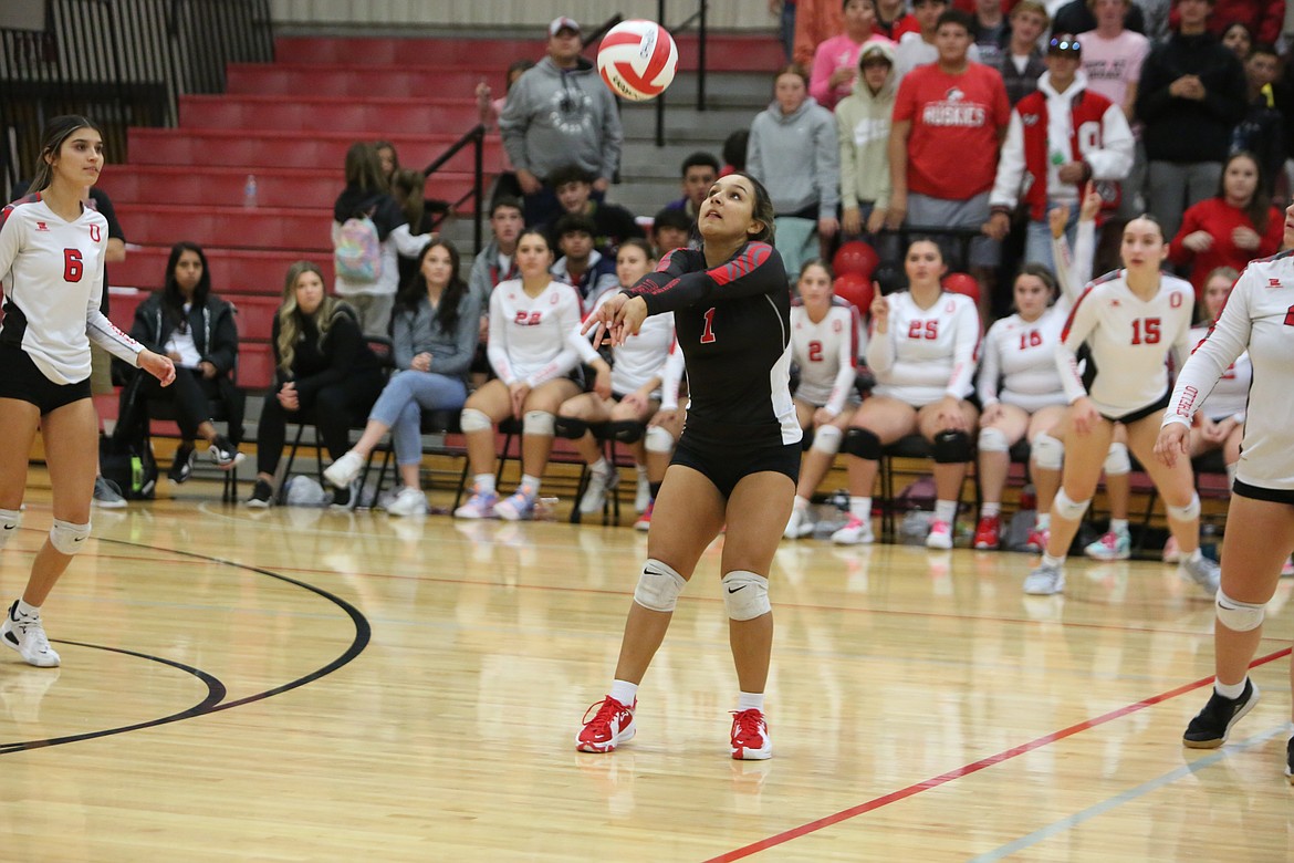 Othello junior Persayis Garcia (1) passes the ball over the net late in the fourth set against Prosser on Tuesday.