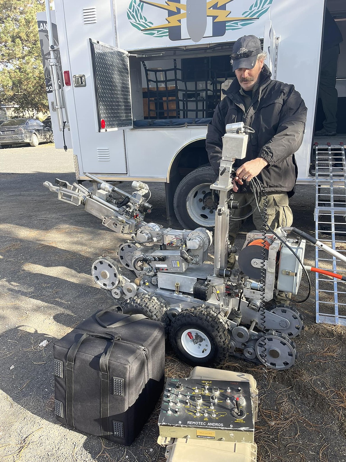 A bomb squad technician readies a robotic vehicle to search a car containing a suspicious device near Othello Wednesday. No actual bomb was found in the vehicle. The item in question was what law enforcement refers to as a distractionary device.