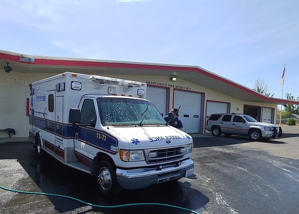 Grant County Fire District 7 staff wash one of department's ambulances. EMS services are expensive to maintain and are one of the most common calls GCFD 7 responds to.