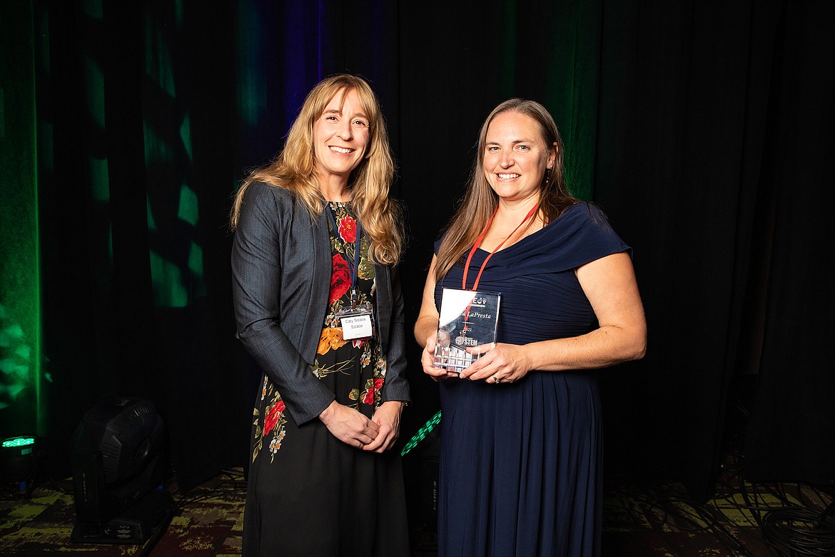 Incoming Idaho STEM Action Center Executive Director Caty Solace, left, congratulates North Idaho STEM Charter Academy teacher Jessica LaPresta after LaPresta received a 2022 Industry's Excellent Educators Dedicated to STEM award at the Idaho Technology Council's Hall of Fame gala Wednesday in Boise.