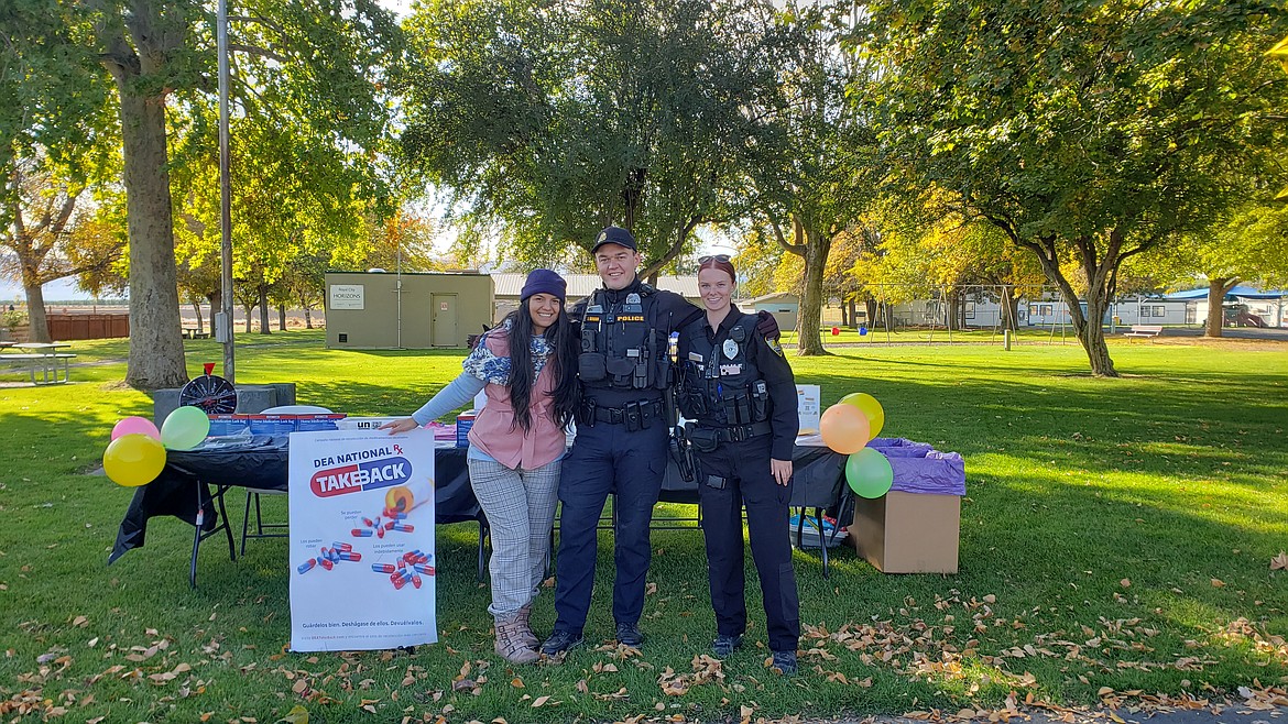 Royal Community Prevention Coalition Coordinator Brisa Sanchez, left, smiles with Royal City Police officers Josh Bronn and Hannah Soelter at the National Drug Take Back event on Oct. 29.