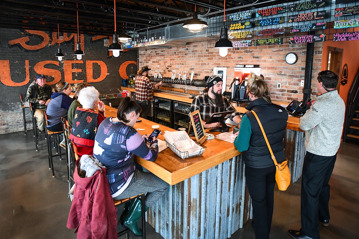 Patrons at the bar at Bias Brewing's new location at 412 S. Main St. in Kalispell on Thursday, Nov. 3. (Casey Kreider/Daily Inter Lake)