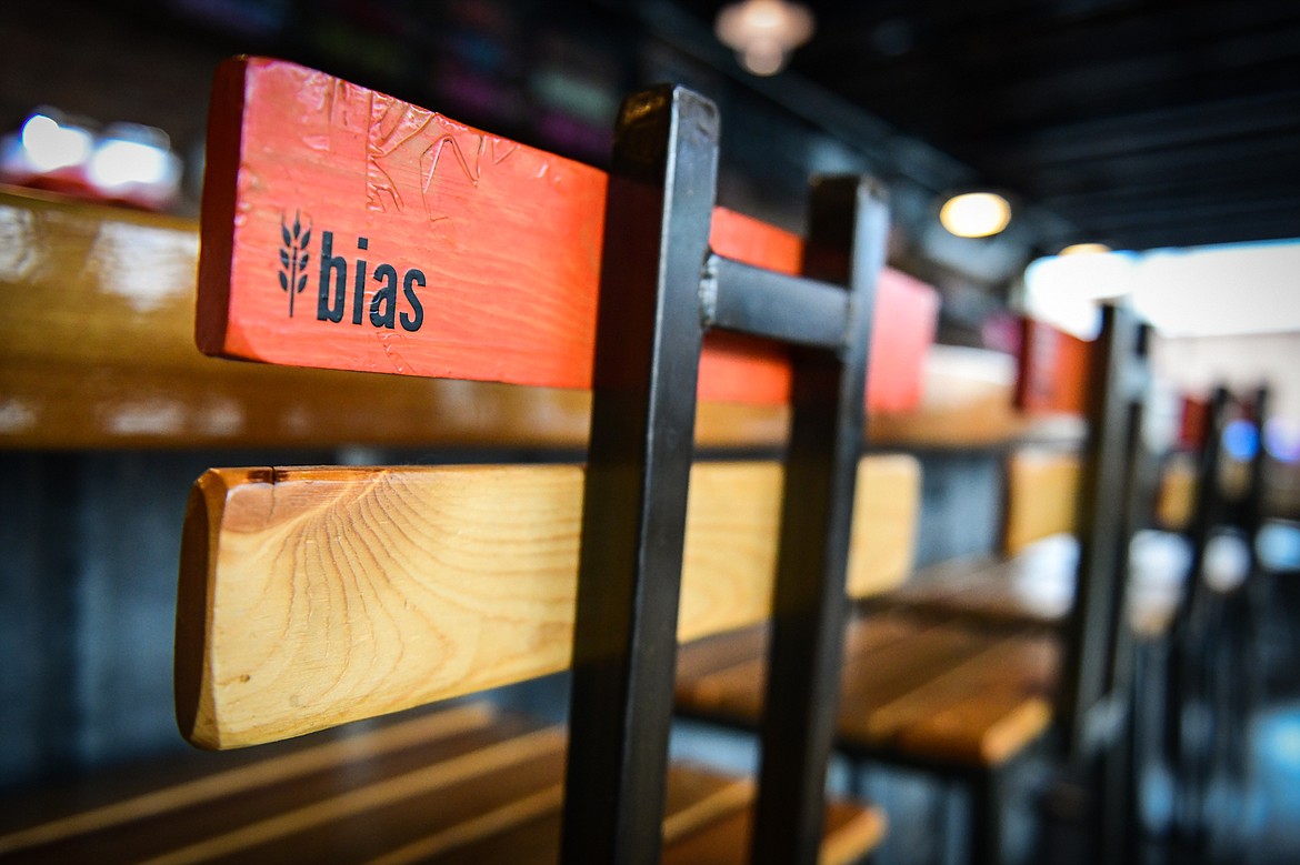 Newly-painted chair backs along the bar at Bias Brewing in Kalispell on Thursday, Nov. 3. (Casey Kreider/Daily Inter Lake)