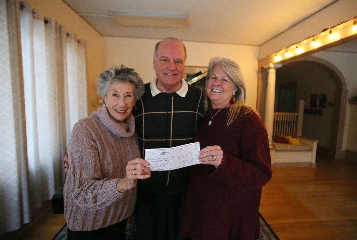 The Coeur d'Alene Arts and Culture Alliance, which manages the Jack Bannon Memorial Fund, presented the Music Conservatory of Coeur d'Alene with a $1,000 check Friday for its free performance of Handel's "Messiah" at 3 p.m. Dec. 4 at North Idaho College. The Jack Bannon Memorial Fund, established in honor of the late actor and Coeur d'Alene resident, is a scholarship fund to encourage students in their quest to further their creative artistic passions. Awards are in the amount of $500. One award will be given to a high school junior or senior and one to a middle school student. From left: Ellen Travolta, Bannon's wife and creator of the scholarship fund; Kent Kimball, Music Conservatory of Coeur d'Alene conductor; and Coeur d'Alene Arts and Culture Alliance Executive Director Ali Shute.