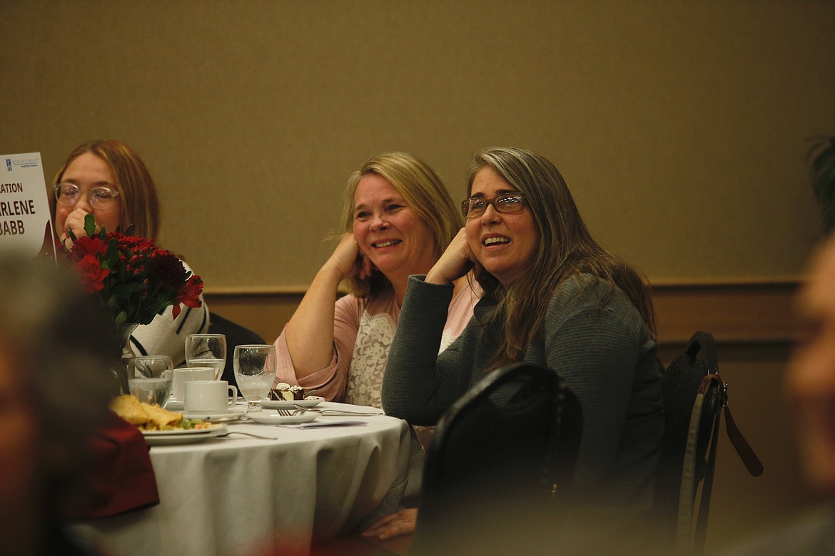Charlene Babb, center, was honored Friday for her work in education. Babb is a teacher at Sorensen Magnet School of the Arts and Humanities, where she facilitates the Advanced Learning Program. KAYE THORNBRUGH/Press