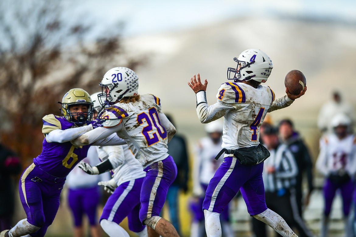 Laurel quarterback Gus Robertus (4) drops back to pass in the second quarter against Polson at Polson High School on Saturday, Nov. 5. (Casey Kreider/Daily Inter Lake)