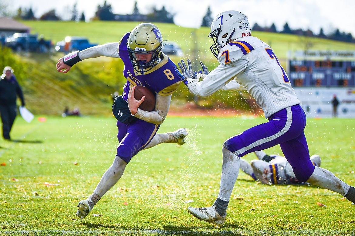 Polson quarterback Jarrett Wilson (8) scores the game-winning touchdown on a 6-yard  run with under a minute remaining in the fourth quarter against Laurel at Polson High School on Saturday, Nov. 5. (Casey Kreider/Daily Inter Lake)