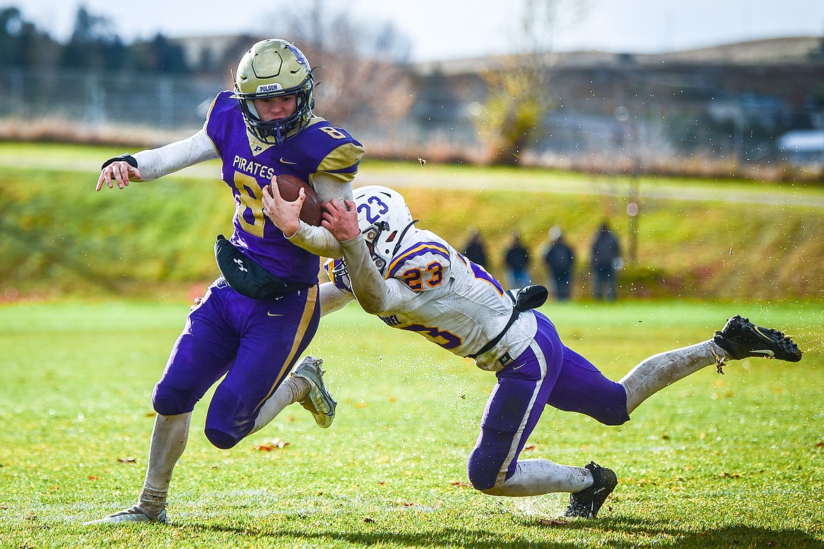 Polson quarterback Jarrett Wilson (8) breaks a tackle on a 6-yard touchdown run with under a minute remaining in the fourth quarter against Laurel at Polson High School on Saturday, Nov. 5. (Casey Kreider/Daily Inter Lake)