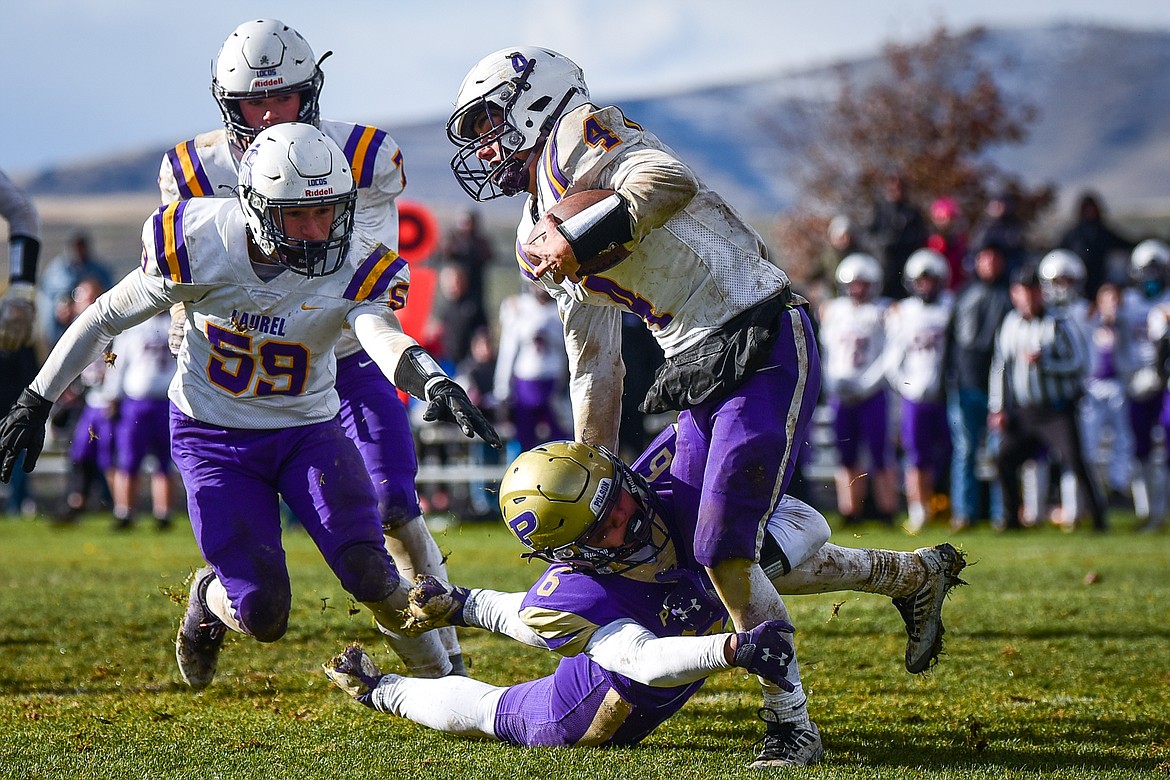 Polson defender Jaren Keene (6) sacks Laurel quarterback Gus Robertus (4) on Laurel's last drive of the game with under a minute remaining in the fourth quarter at Polson High School on Saturday, Nov. 5. (Casey Kreider/Daily Inter Lake)