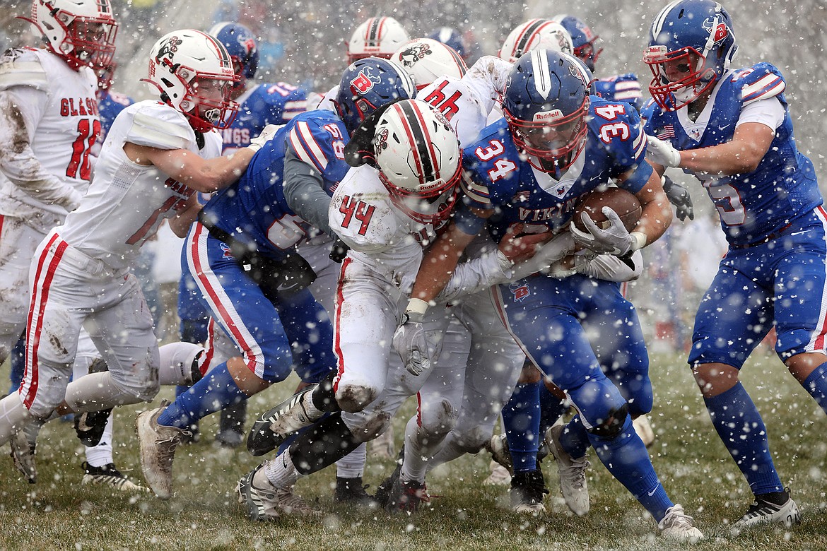 Vikings running back Joseph Farrier battles the Glasgow defense and the weather in the second quarter of Bigfork’s 52-12 win over Glasgow in the State B Quarterfinals in Bigfork on Saturday, Nov. 5. (Jeremy Weber/Daily Inter Lake)