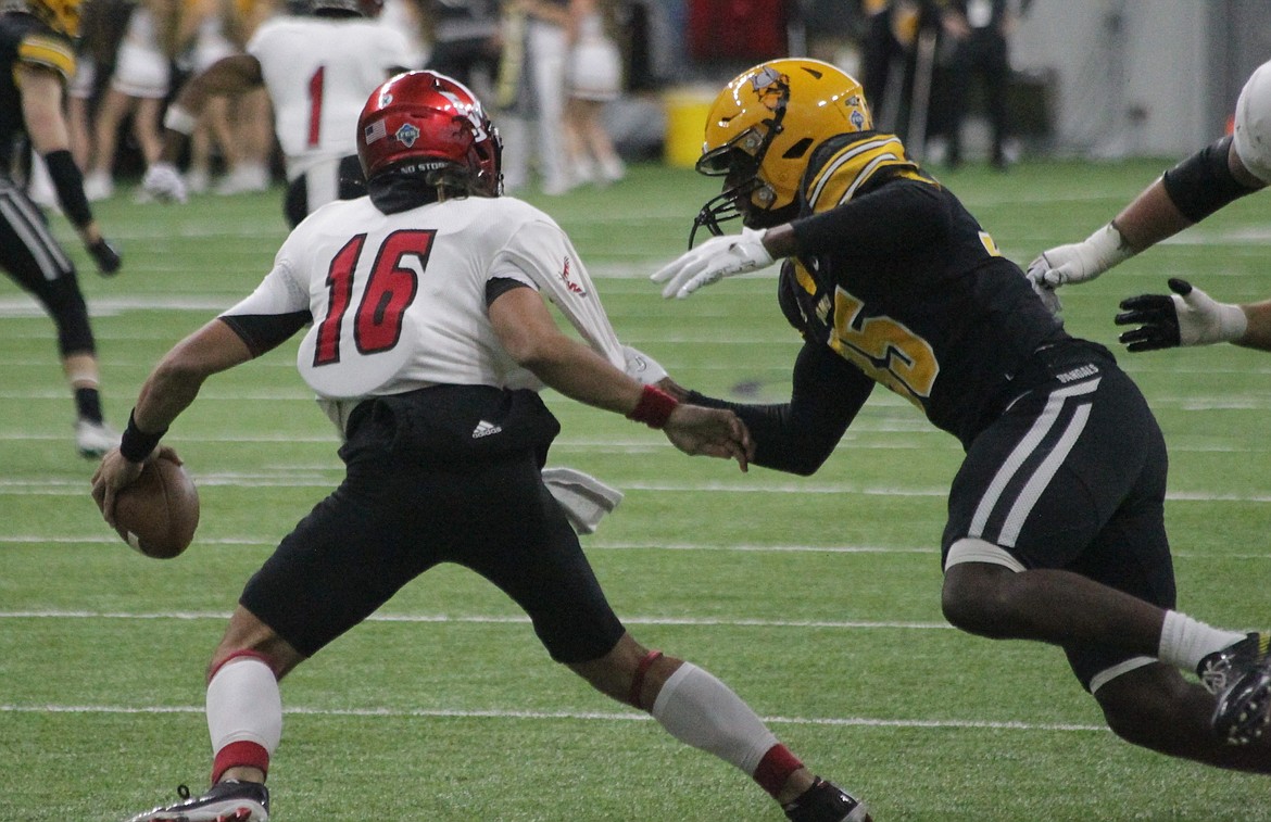 MARK NELKE/Press
Idaho sophomore Kemari Bailey tackles Eastern Washington backup quarterback Kekoa Visperas during the first half Saturday in Moscow.