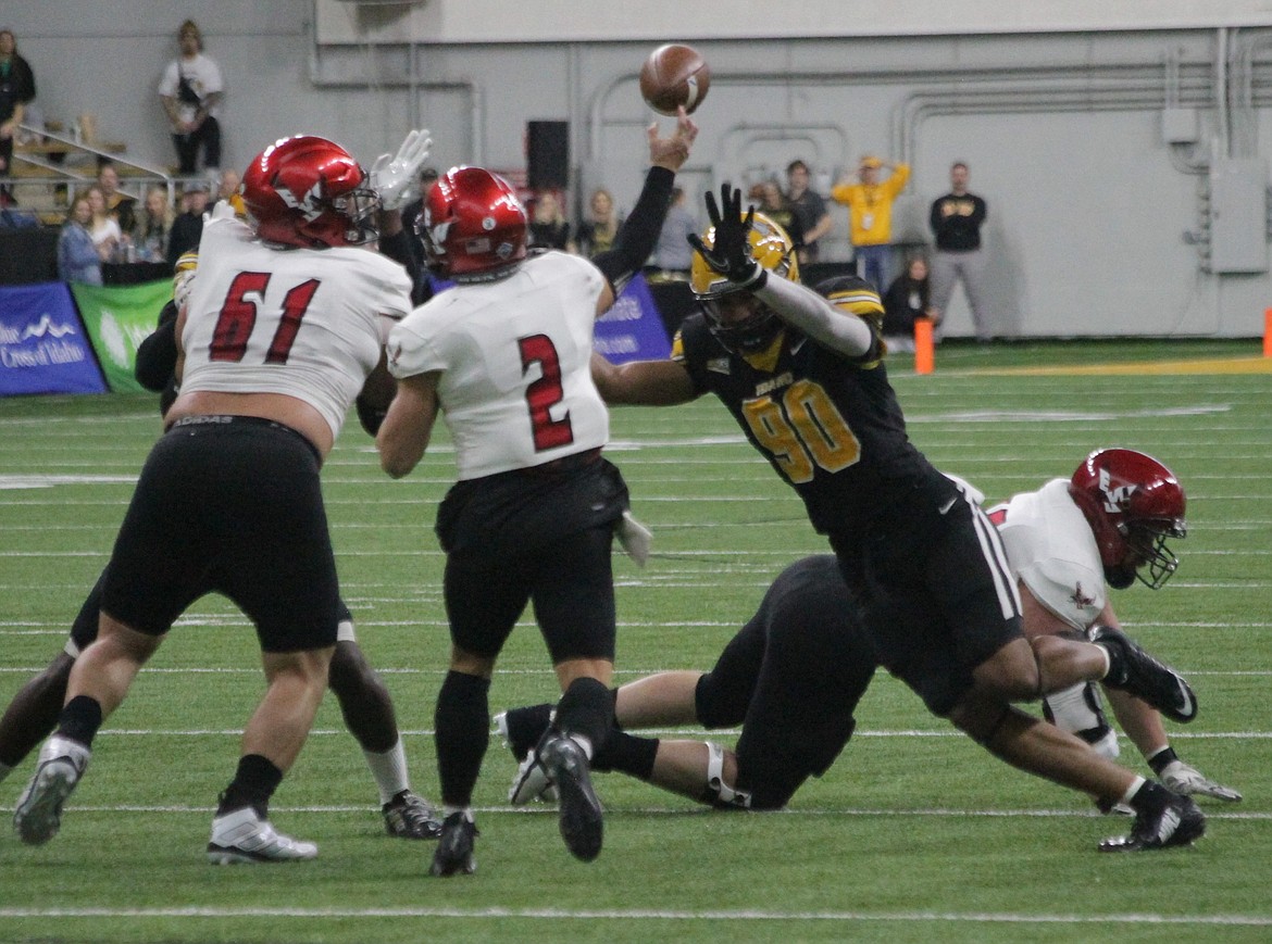 MARK NELKE/Press
Idaho's Malakai Williams (90) pressures Eastern Washington quarterback Gunner Talkington on Saturday in Moscow.