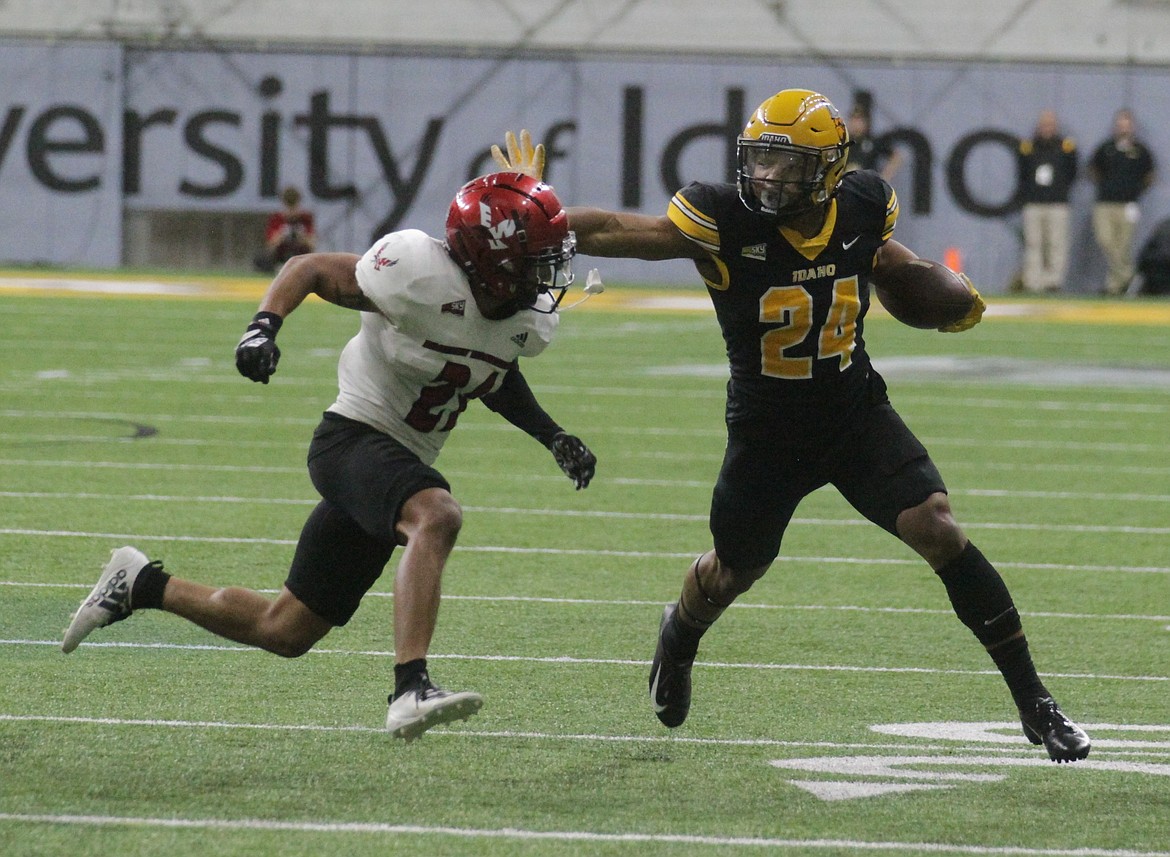 MARK NELKE/Press
Roshaun Johnson (24) of Idaho fends off Keshaun King of Eastern Washington in the second half Saturday in Moscow.