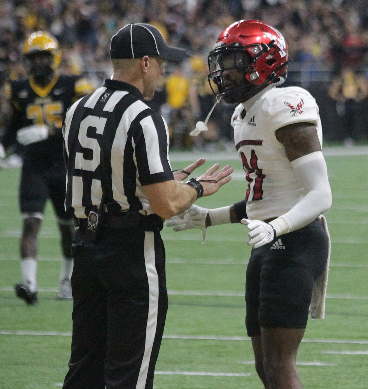 MARK NELKE/Press
Defensive back Demetrius Crosby Jr., right, of Eastern Washington pleads his case to an official after giving up a touchdown pass in the first half Saturday in Moscow.