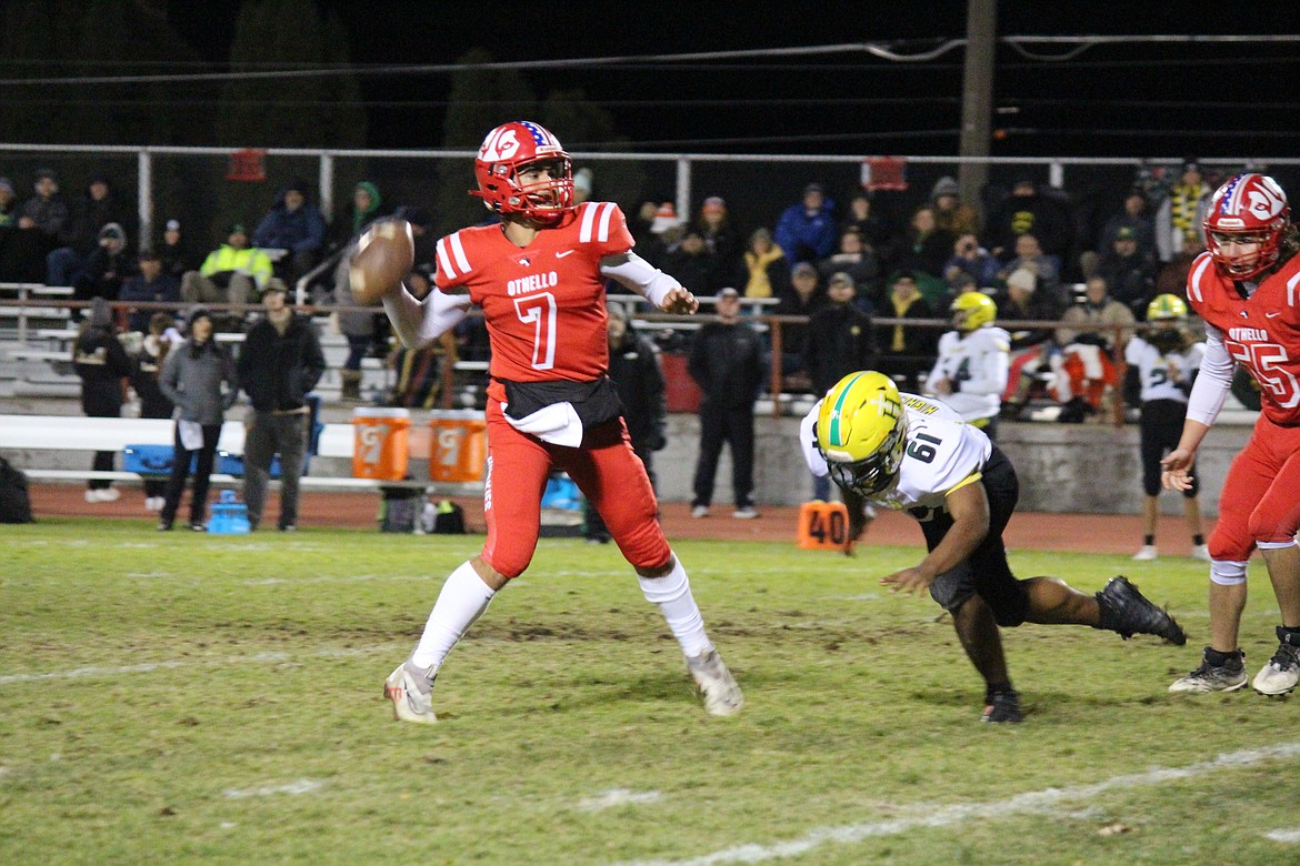 Othello quarterback Maddox Martinez (7) goes back to pass against Shadle Park.