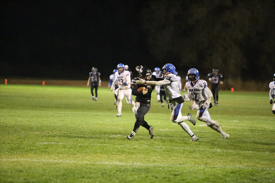 ACH sophomore Carter Pitts stiff arms a defender on a 46-yard catch-and-run to set up the Warriors’ go-ahead touchdown late in the fourth quarter.