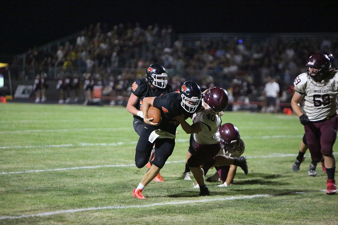 Senior quarterback Travis Hendrick (4) rushed for 146 yards in Ephrata’s 17-7 win over Clarkston on Friday night, guiding the Tigers to a state berth.