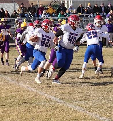 Superior running back Owen Doyle (32) follows a block by senior offensive lineman Wyatt Haworth during the Bobcats playoff game in Culbertson this past Saturday. (Kami Milender photo)