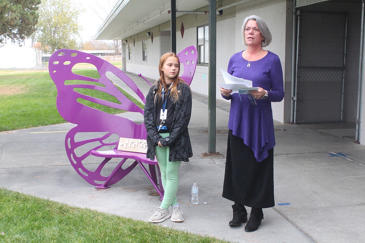 Lana Redal, right, talks about her granddaughter Ella Muongmany during the dedication of a bench in Ella’s honor at Larson Elementary School Friday. Penelope Smiley, left, was a friend of Ella’s and still comes around to visit, Redal said.