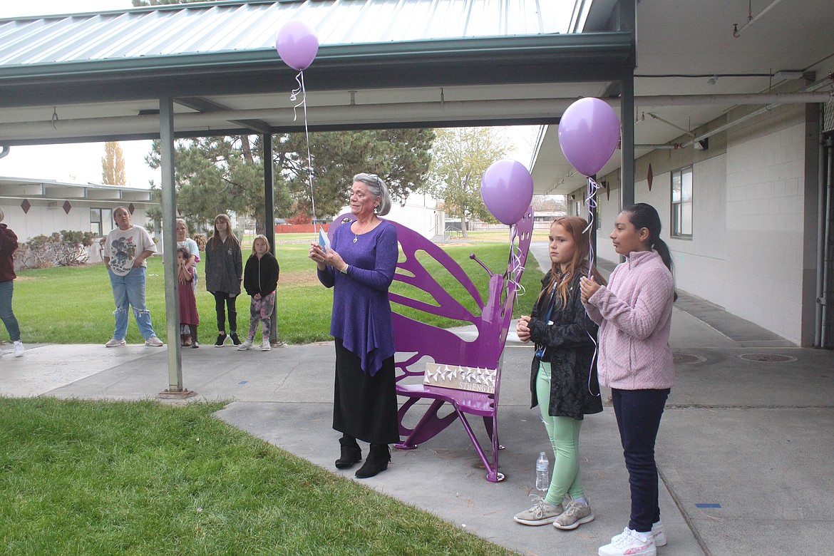 From left: Lana Redal, Penelope Smiley and Ayali Guiterrez release balloons in memory of Redal’s granddaughter Ella Moungmany. The two girls were friends of Ella’s, Redal said, and remain friends of the family.