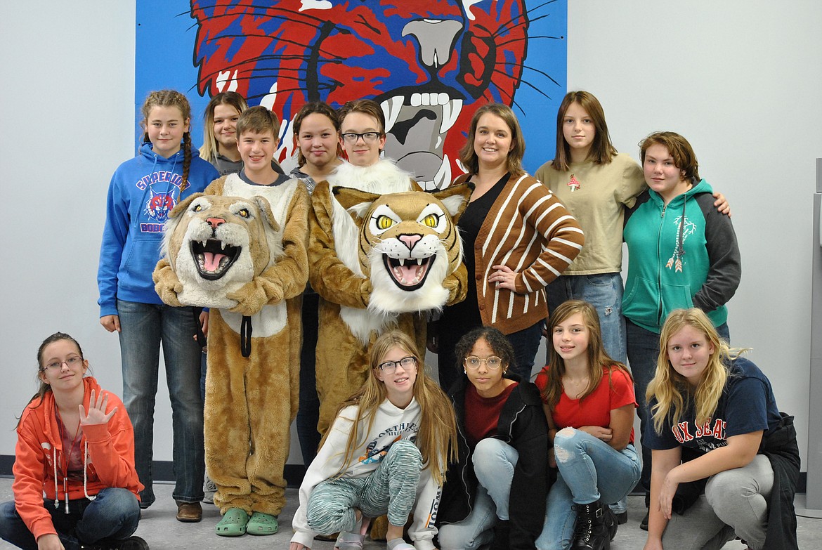 The Superior Pep Club with their old bobcat suit, and the new mascot that's in search of a name. Front row, from left, Laney North, Ava White, Eve Farnsworth, Mia Sparks, Kaydi Erickson. Mascots: Henry Hanson, Ethan Durovey. Back row, left to right: Rainier Acker, Karina Pearce, Lani Ruthford, Tamara Durovey, Melissa Rhodes, and Danica Wilson. Not pictured: Lanie Crabb, and Josie Crabb. (Amy Quinlivan/Mineral Independent)