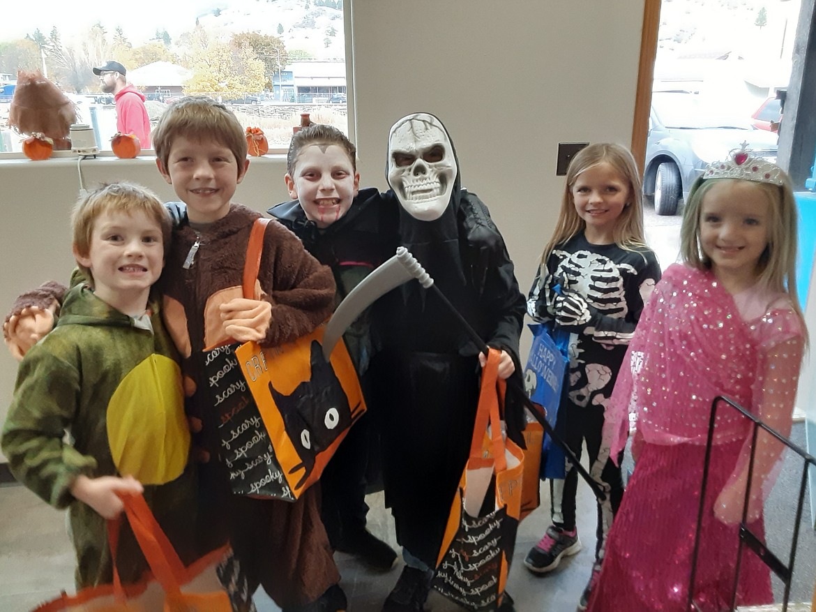 A group of tick or treaters stop at the Clark Fork Valley Press office on Halloween. (Lisa Larson photos/Valley Press)