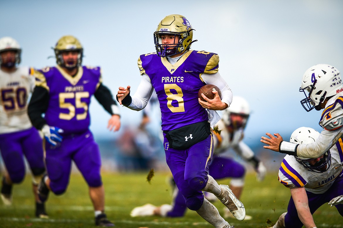 Polson quarterback Jarrett Wilson (8) picks up yardage on a run in the third quarter against Laurel at Polson High School on Saturday, Nov. 5. (Casey Kreider/Daily Inter Lake)