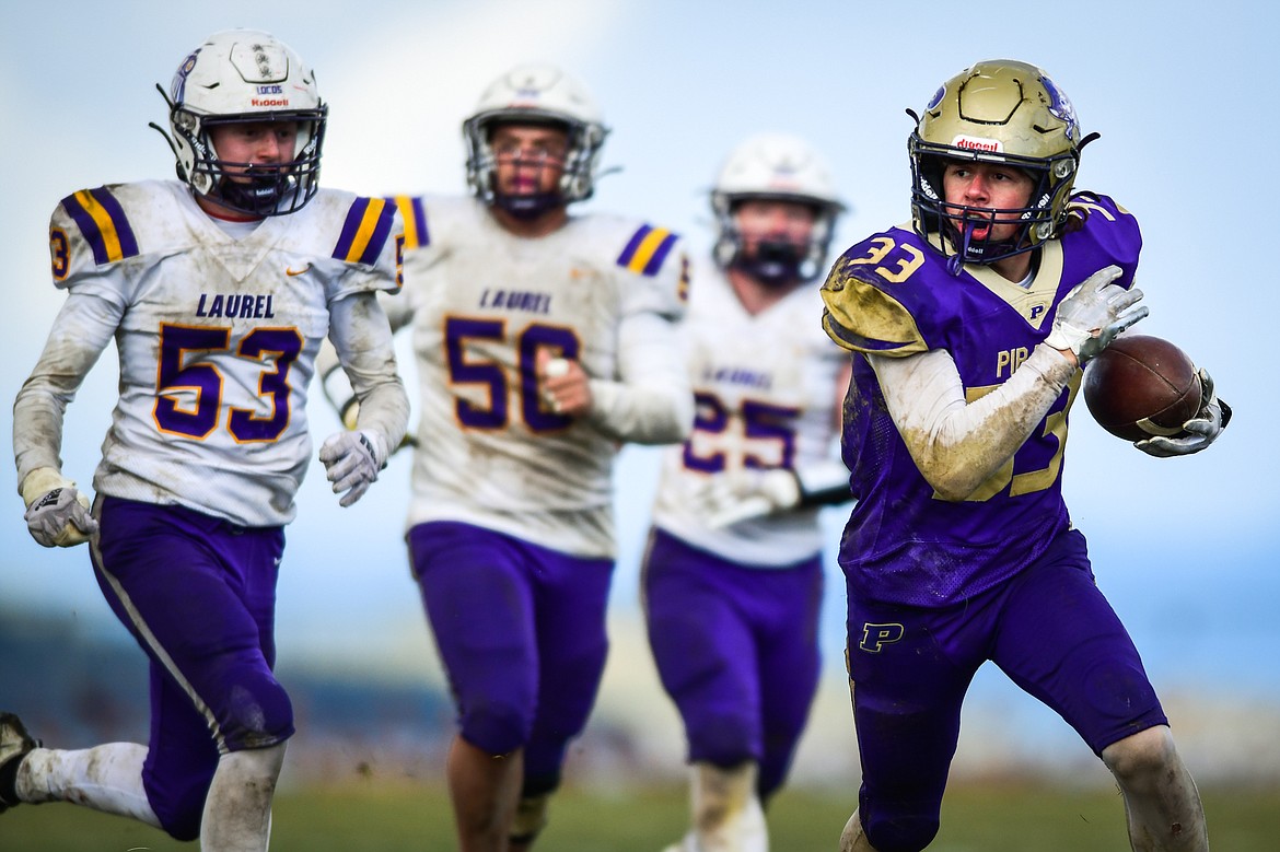 Polson running back Keyen Nash (33) picks up yardage on a run in the third quarter against Laurel at Polson High School on Saturday, Nov. 5. (Casey Kreider/Daily Inter Lake)